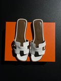 Mules Hermès Oran blanche / marron