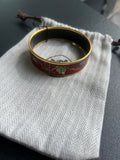 Bracelet Hermès céramique
rouge avec housse