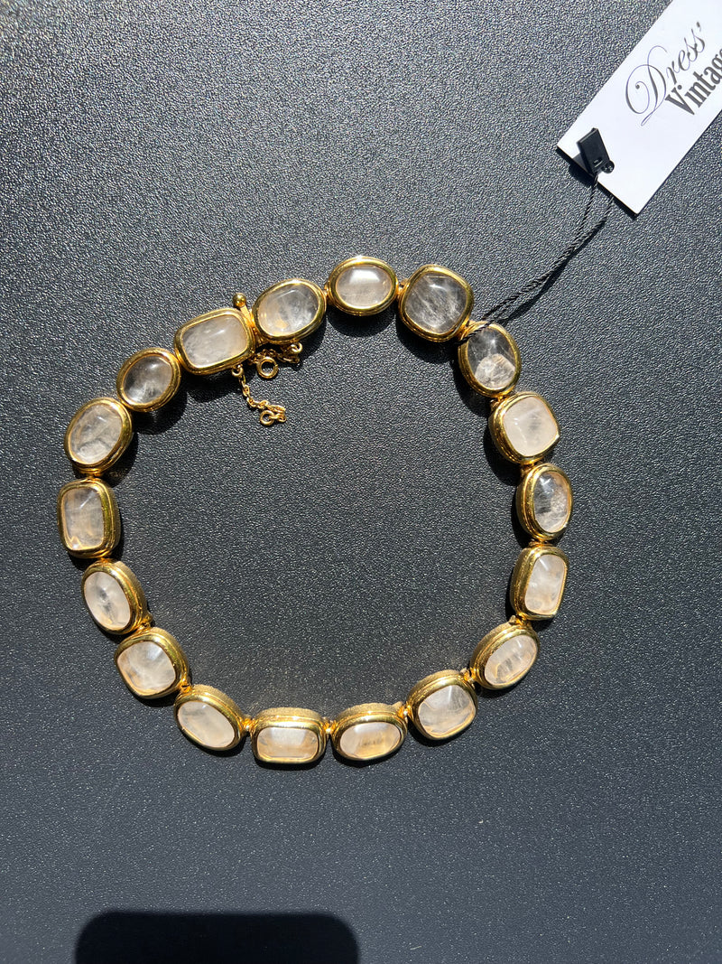 Ras du cou Gossens pierres blanche entouré de doré